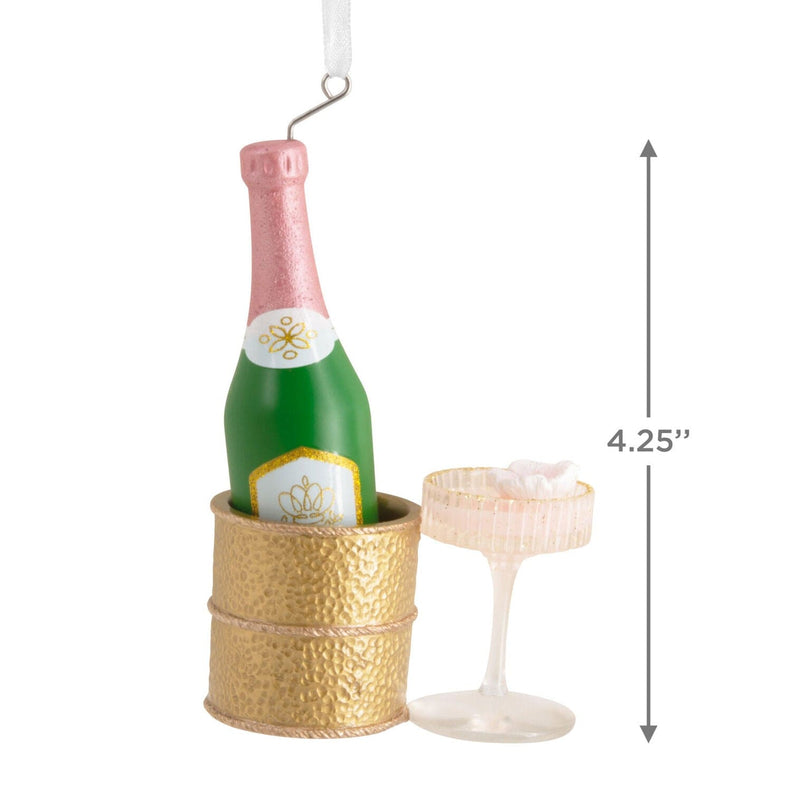 Hallmark ornament with champagne bottle in gold chiller and coupe glass
