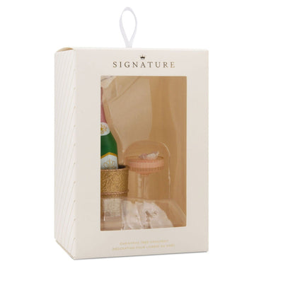 Hallmark ornament with champagne bottle in gold chiller and coupe glass
