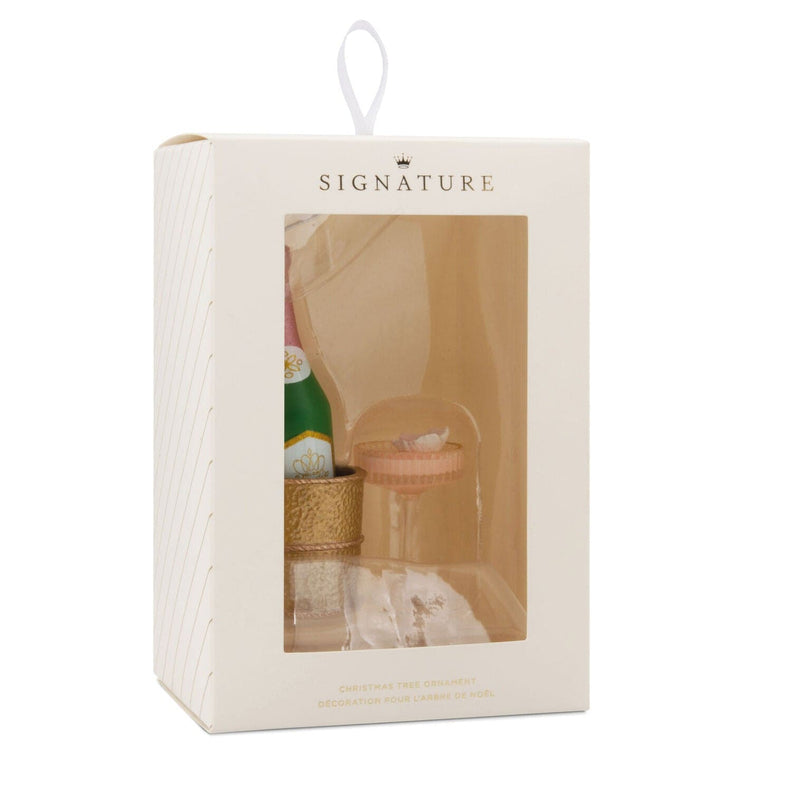 Hallmark ornament with champagne bottle in gold chiller and coupe glass
