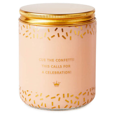 Festive Hallmark single-wick candle with orange and pear scent, coral confetti design, and “Congrats!” message.

