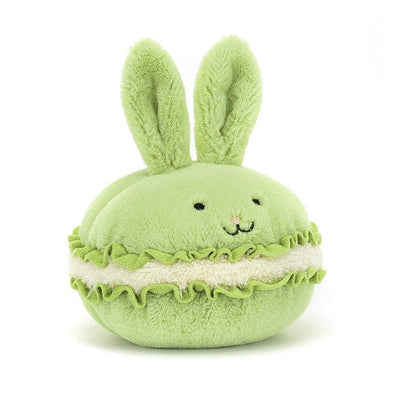 Stuffed animal shaped like a green macaron with bunny ears by Jellycat