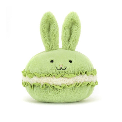 Stuffed animal shaped like a green macaron with bunny ears by Jellycat