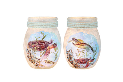 Frosted glass Sea Turtles Small Jar with jute rope trim, seashell charm, and glowing mini lights for cozy coastal decor.


