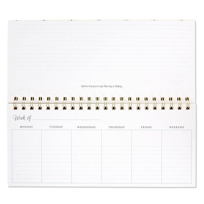 Spiral-bound weekly calendar with uplifting “This Is the Day” scripture theme and floral design for desk or tabletop use.

