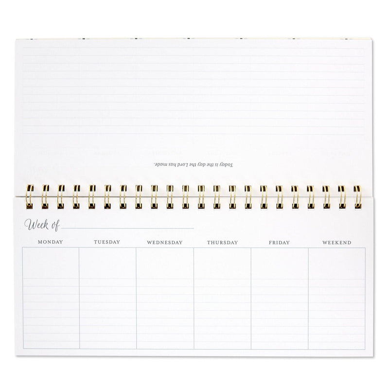 Spiral-bound weekly calendar with uplifting “This Is the Day” scripture theme and floral design for desk or tabletop use.

