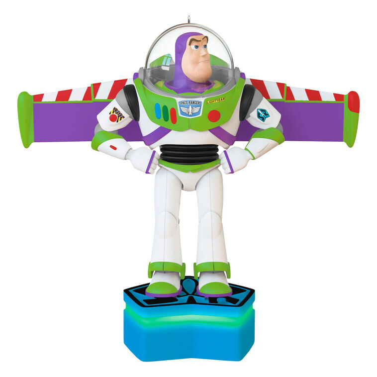 Buzz Lightyear Christmas ornament with wings extended on blue base, featuring light and sound effects