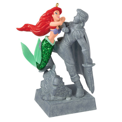 Ariel Christmas ornament gazing at Prince Eric's stone statue, tail curled behind her, from Disney's The Little Mermaid
