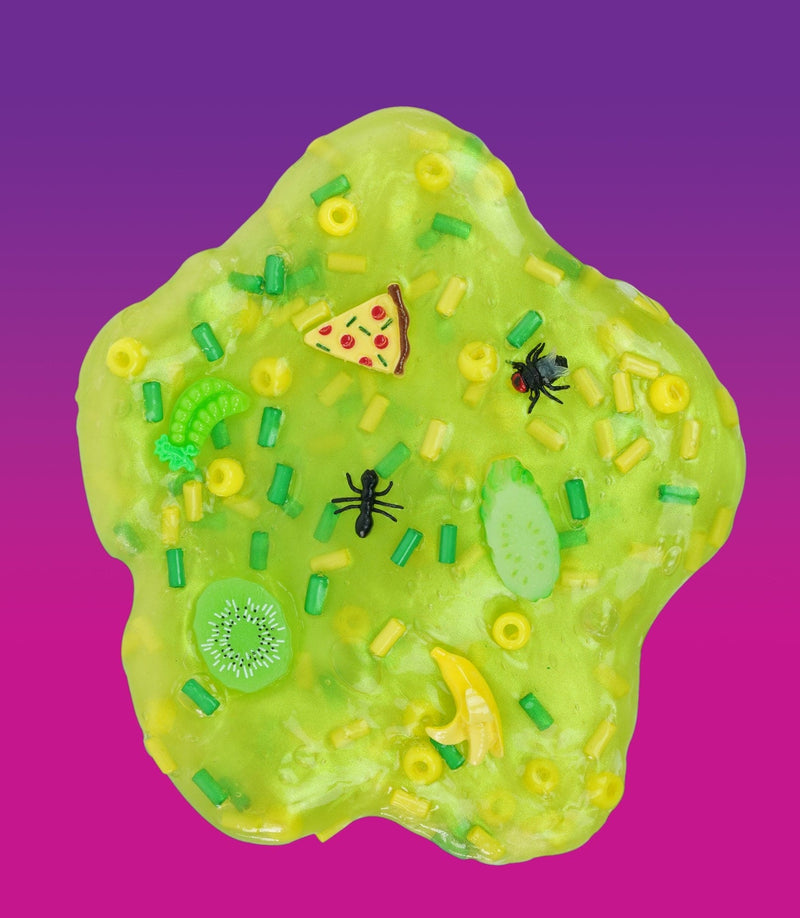 Crazy Aaron’s green Dumpster Dive slime with fun food scrap, bug, and crystal charms for squishy, stretchy sensory play. 