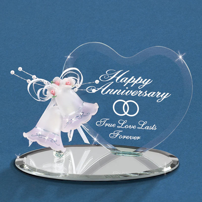 
Handcrafted glass pair of anniversary bells placed on a hand beveled glass mirror with a heart-shaped back plate.