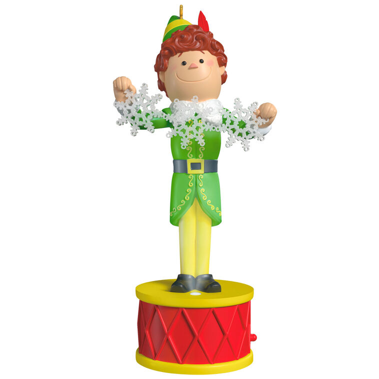 Buddy the Elf ornament with light and sound, standing on red base in green costume with snowflakes, inspired by the movie “Elf”