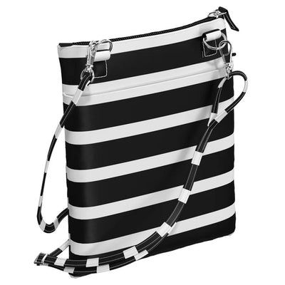 Compact Late Bloomer crossbody bag with adjustable strap, 3 zip compartments, and back pocket—lightweight and hands-free.