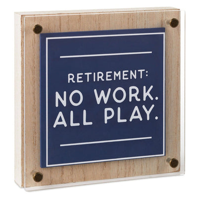 Square retirement wall decor with "No work, all play" message in white on layered blue wood and clear acrylic   6.5 inches.