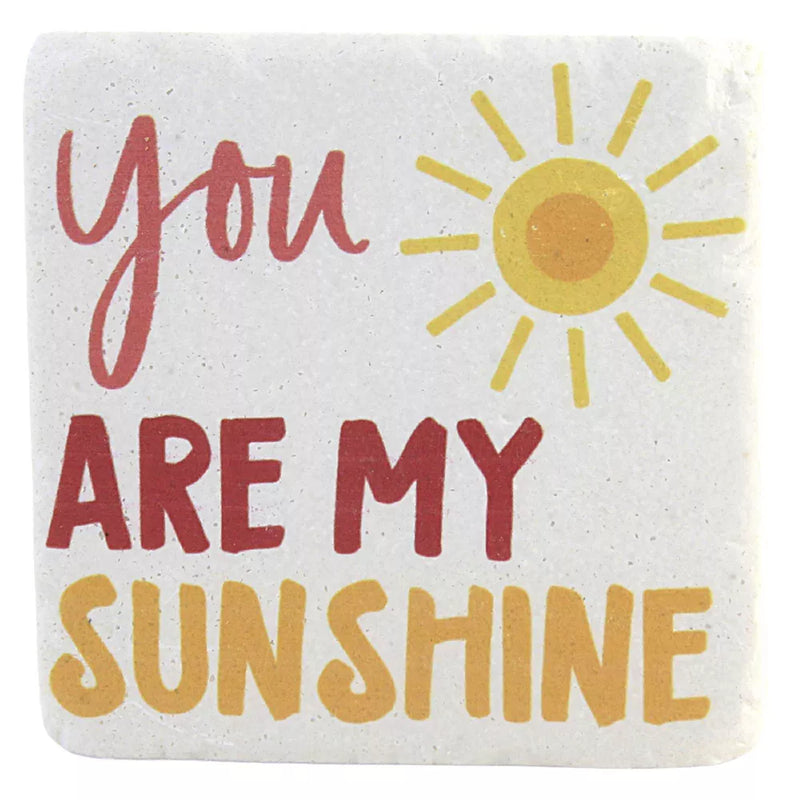 A set of four off-white coasters, each with a different sun design and cheerful quote like "You Are My Sunshine".

