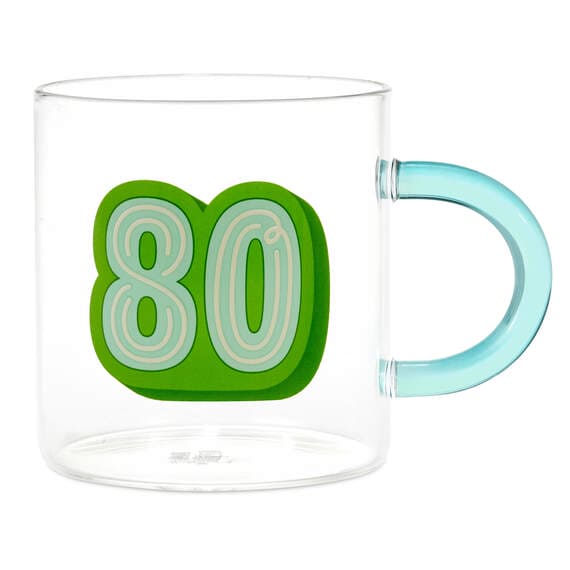 Clear glass mug with green handle. Number "80" printed on the side in green