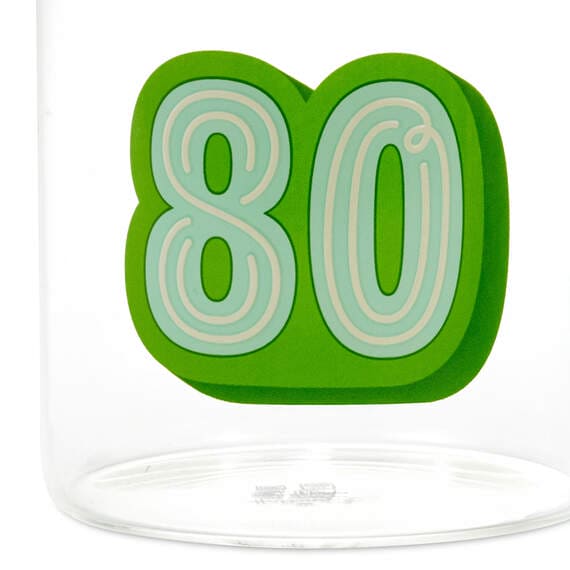 Clear glass mug with green handle. Number "80" printed on the side in green