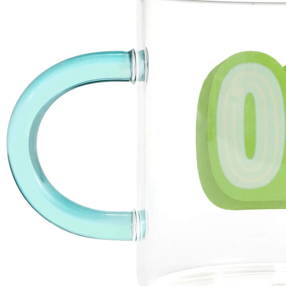 Clear glass mug with green handle. Number "80" printed on the side in green