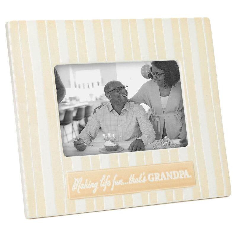 Hallmark yellow and white striped ceramic picture frame with "Making life fun...that&