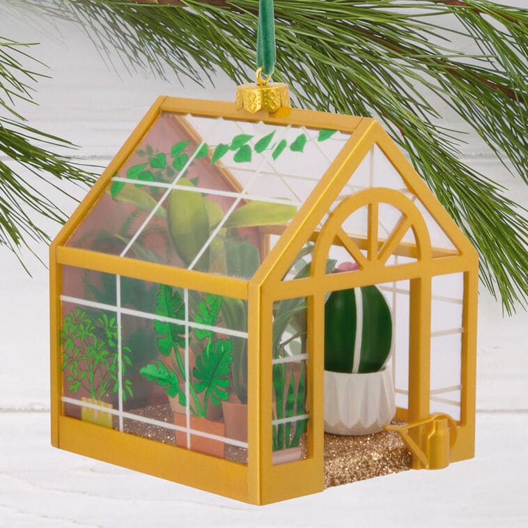 Hallmark greenhouse ornament with potted plants and gold floor

