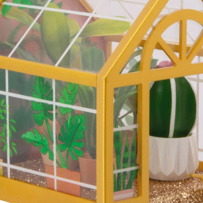Hallmark greenhouse ornament with potted plants and gold floor
