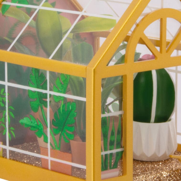 Hallmark greenhouse ornament with potted plants and gold floor
