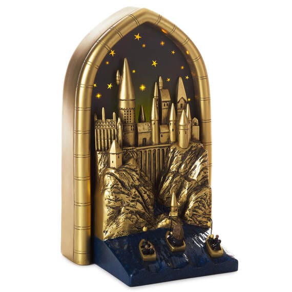 Hallmark Harry Potter light-up Hogwarts bookshelf decoration with starry night background and dimensional castle design.

