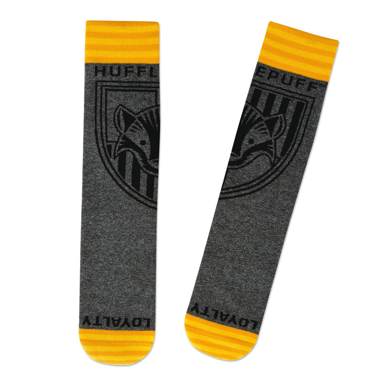 Hallmark Hufflepuff crew socks with gray marled knit and yellow stripes and toe accents shown flat against a white background