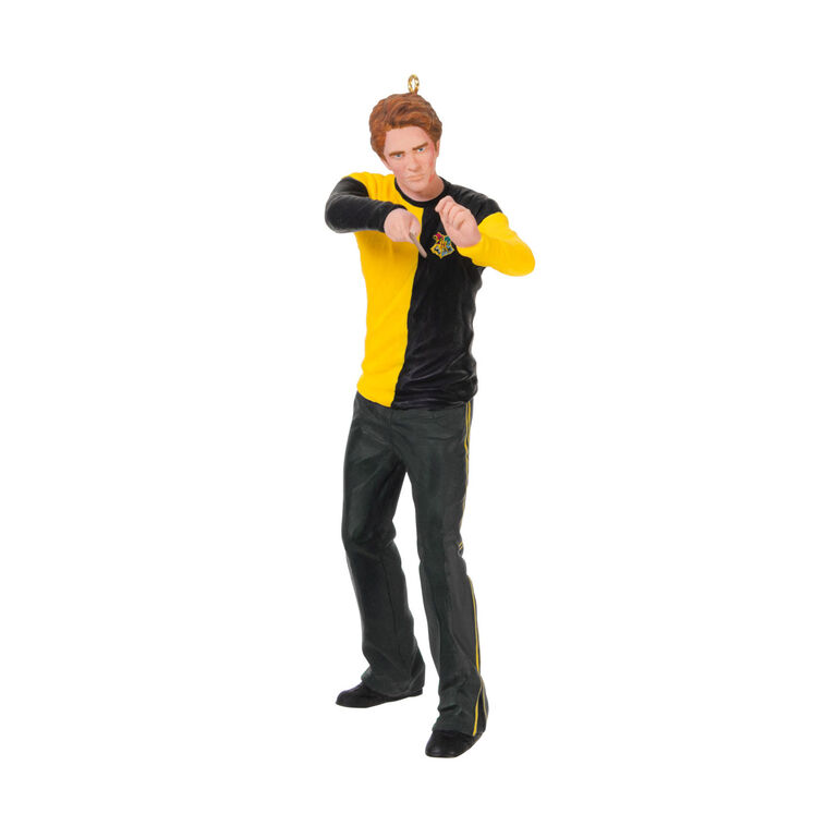 Cedric Diggory in yellow and black Hufflepuff robes raising his wand in a Harry Potter Christmas tree ornament