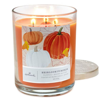 Three-wick Hallmark candle in glass jar with pumpkin and brown butter scent, perfect for cozy fall home décor.

