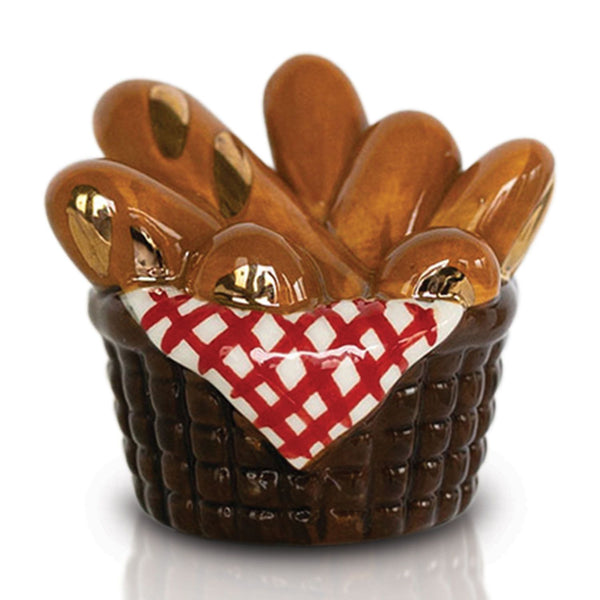 Nora Fleming mini bread basket with loaves wrapped in a red gingham napkin; cozy table accent for seasonal gatherings 