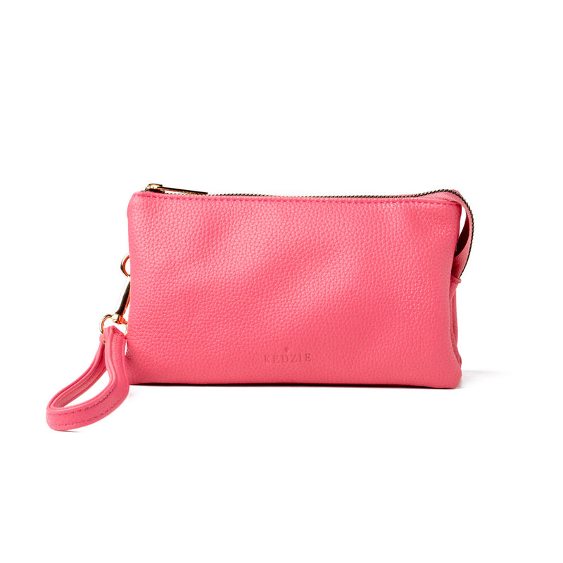 Pink Kedzie Eclipse Crossbody with wristlet and crossbody straps, three zip pockets, and built-in card slots.

