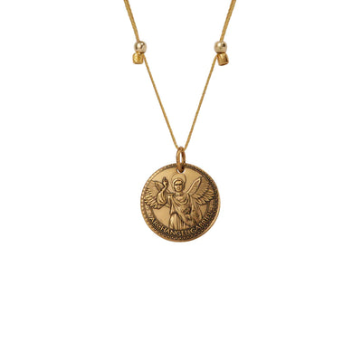 a gold vermeil necklace with a round medallion pendant. The text “ARCHANGEL GABRIEL” is engraved around the edge of the medallion.