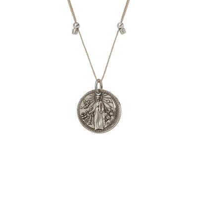 a siliver vermeil necklace with a round medallion pendant. The text “Divine Mother” is engraved around the edge of the medallion.