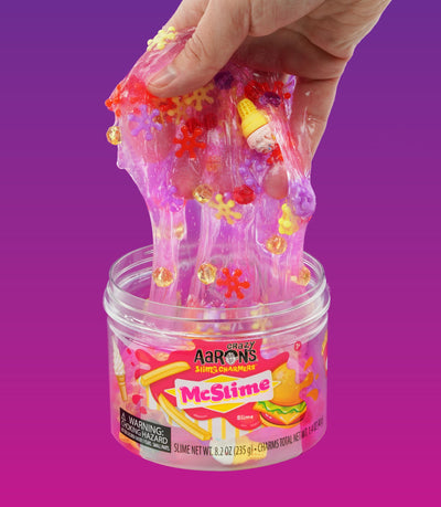 Purple slime with burger, hot dog, fries, and drink charms in a fast food theme, scented like watermelon.