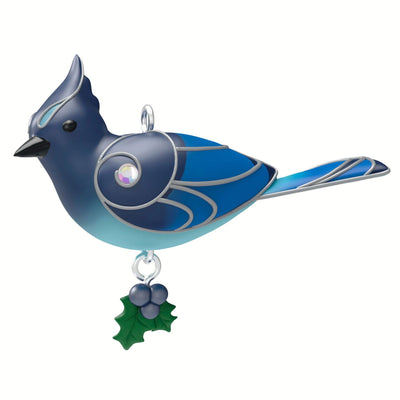 Christmas ornament depicting a bluebird perched on a snowy branch