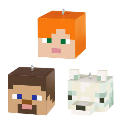 Set of three Minecraft mini ornaments featuring Alex, Steve, and an arctic fox heads in pixelated cube style with dimensional ears.