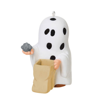 Miniature Charlie Brown Halloween ornament dressed as ghost holding rock from Peanuts Gang