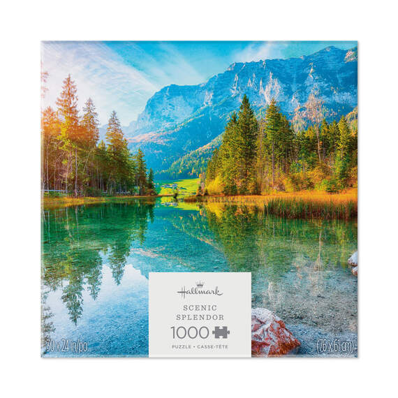 Hallmark Scenic Splendor puzzle featuring a clear lake, evergreen trees, and snow-capped mountain under a bright blue sky.

