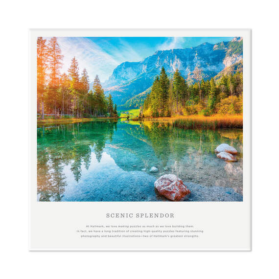 Hallmark Scenic Splendor puzzle featuring a clear lake, evergreen trees, and snow-capped mountain under a bright blue sky.

