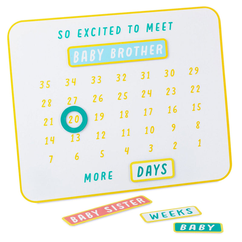 Metal magnetic baby countdown board with customizable stickers tracking days or weeks to baby’s arrival.

