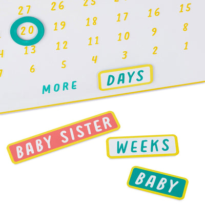 Metal magnetic baby countdown board with customizable stickers tracking days or weeks to baby’s arrival.

