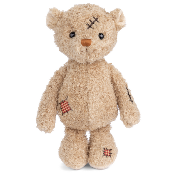 Plush bear with a scar on its head and wound on its side, 11 inches tall, a symbol of resilience and strength, perfect for motivation.

