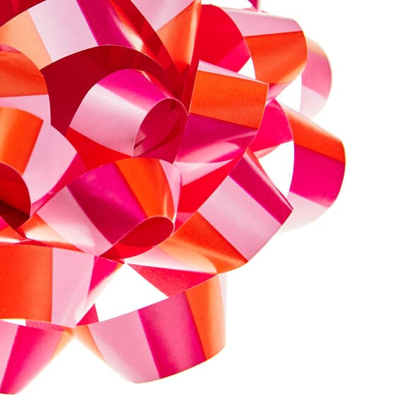 Pink and coral striped recyclable gift bow with self-adhesive backing, 4.6 inches diameter.
