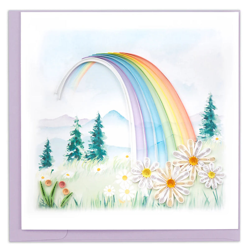 Quilled card with a rainbow arching over a mountain landscape and colorful flowers in the foreground. Symbol of hope and new beginnings.