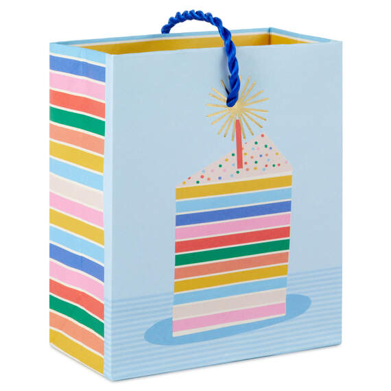 Mini gift bag with colorful layered cake slice design, gold foil accents, and pale blue background with twisted cord handles.


