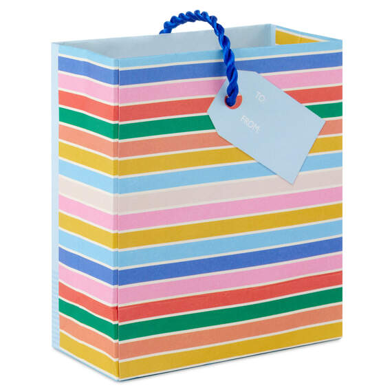 Mini gift bag with colorful layered cake slice design, gold foil accents, and pale blue background with twisted cord handles.

