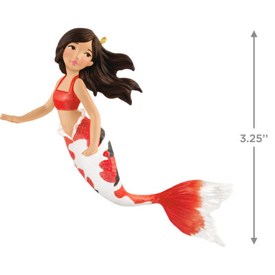 Hallmark Keepsake mermaid ornament with red and black iridescent tail, brunette hair, and white top in floating holiday pose.