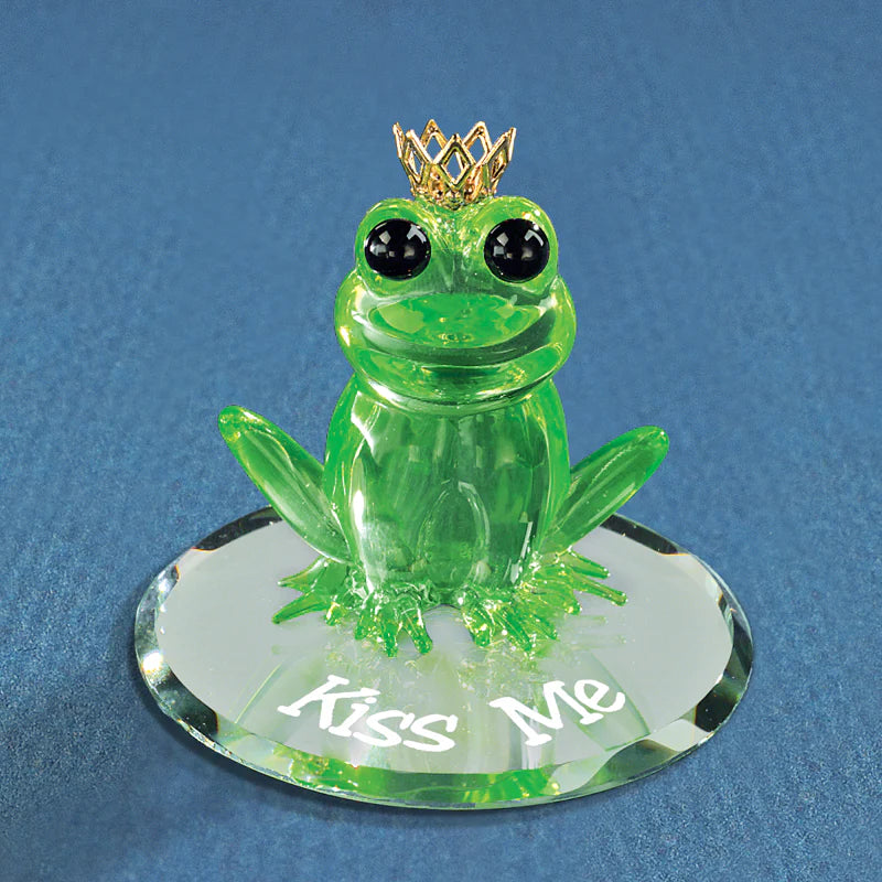Handcrafted green glass frog wearing a crown with “Kiss Me” message, on beveled mirror with crystal accents.
