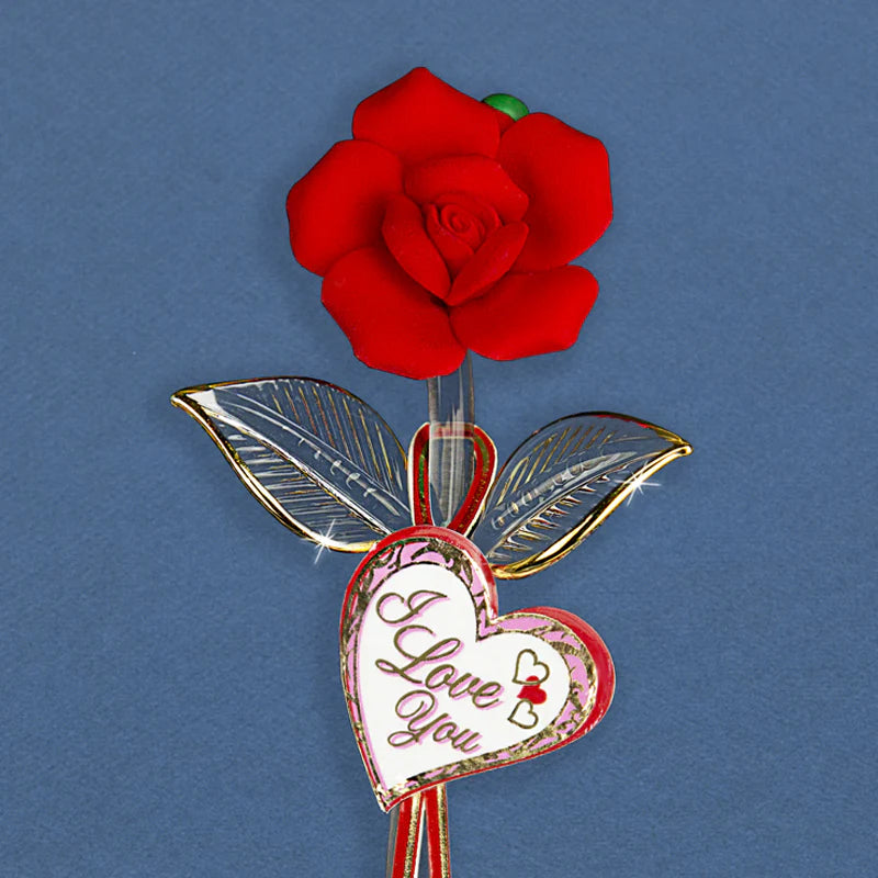 Glass red rose with gold accents and an “I Love You” message tag on the stem.
