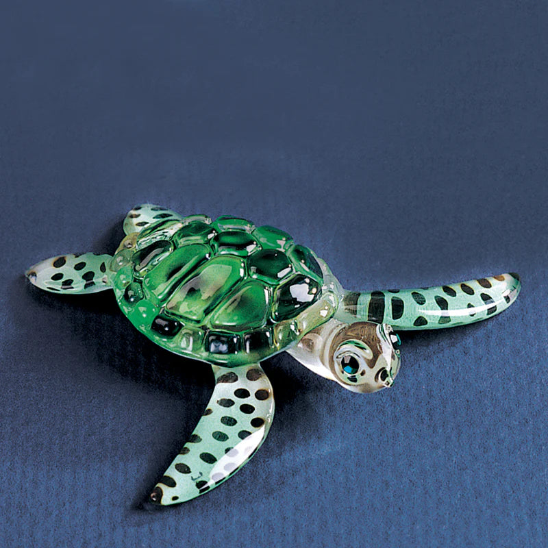 Handcrafted glass sea turtle figurine embossed with color and accented with genuine crystals.