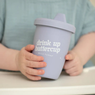 Bella Tunno Drink Up Buttercup Happy Sippy Cup made of durable food-safe silicone with removable handles, soft spout.